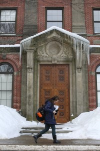 Students walk to class past Beaven Hall during a cold winter day.