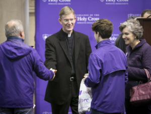 Rev. Philip L. Boroughs, S.J., president of the College, chatting with Holy Cross families. Photo by Shannon Power Photography